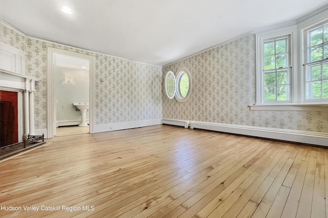 55 Leggett Rd, Stone Ridge, NY 12484 - unfurnished living room with light wood-type flooring, a fireplace with raised hearth, wallpapered walls, ornamental molding, and a baseboard heating unit