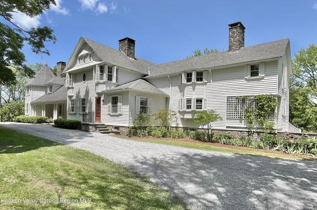 55 Leggett Rd, Stone Ridge, NY 12484 - view of front of house with a chimney and gravel driveway