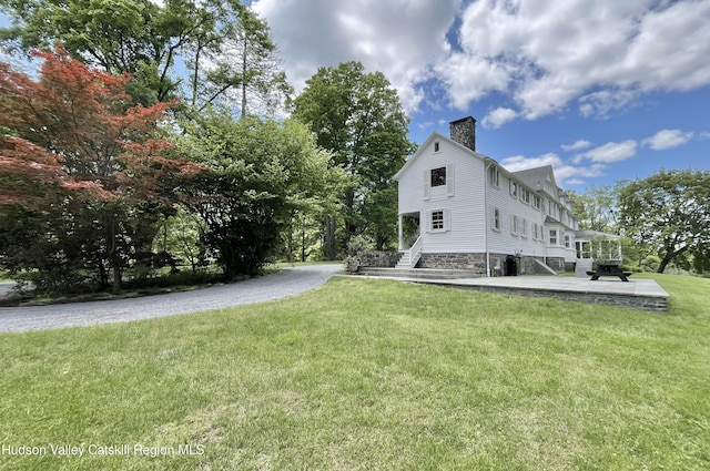 55 Leggett Rd, Stone Ridge, NY 12484 - view of side of home with a chimney, a yard, and stairs