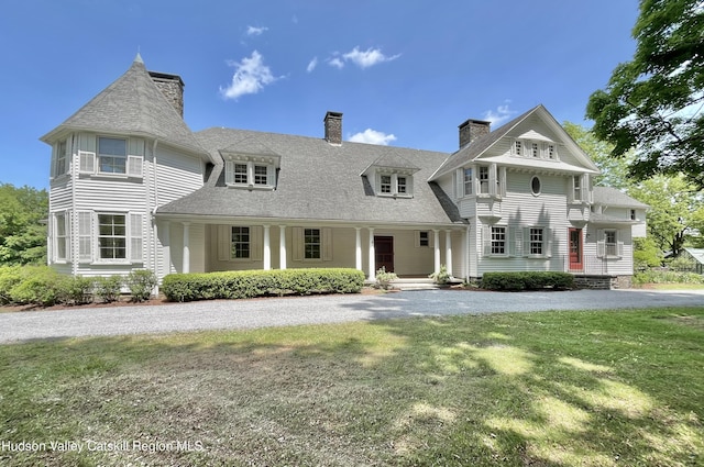 55 Leggett Rd, Stone Ridge, NY 12484 - view of front facade with a chimney, a front lawn, driveway, and a porch