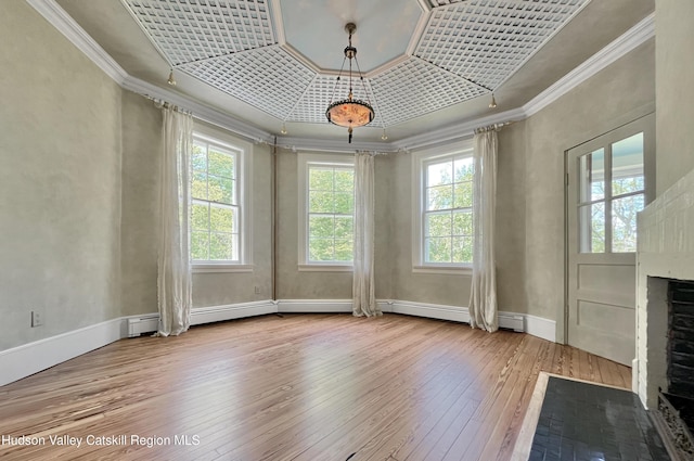 55 Leggett Rd, Stone Ridge, NY 12484 - unfurnished dining area with hardwood / wood-style flooring, crown molding, a fireplace, and baseboards