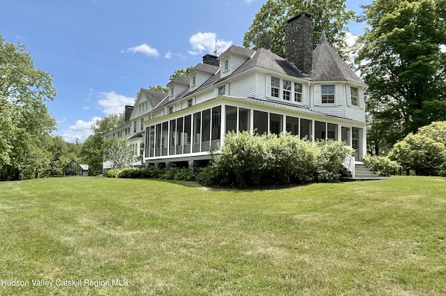 55 Leggett Rd, Stone Ridge, NY 12484 - back of house with a sunroom, a chimney, and a yard