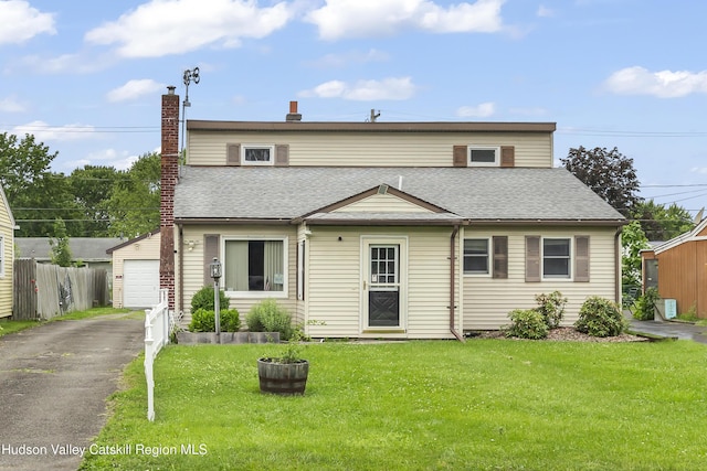 321 Lincoln Blvd, Hudson, NY 12534 - view of front of property featuring driveway, a garage, roof with shingles, a chimney, and an outbuilding
