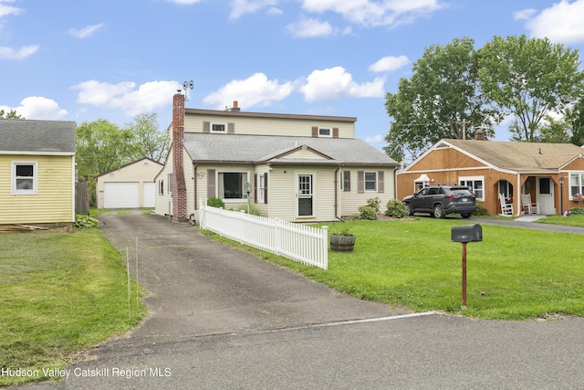 321 Lincoln Blvd, Hudson, NY 12534 - view of front of home featuring an outbuilding, a garage, and a chimney