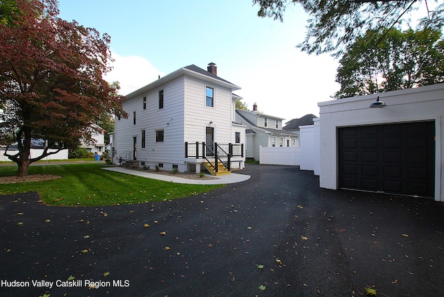 view of side of property featuring a garage