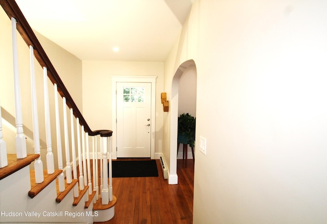 entryway featuring dark hardwood / wood-style floors and baseboard heating