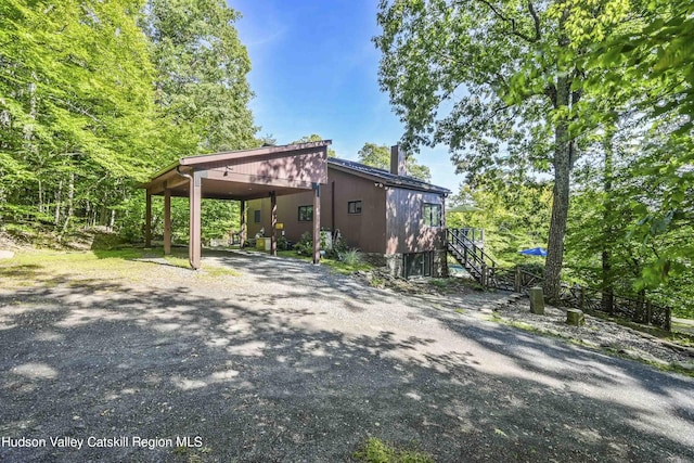 exterior space featuring a carport