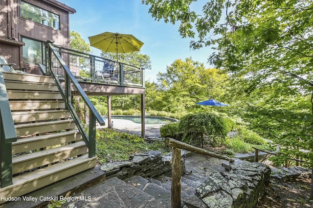 exterior space featuring a pool side deck