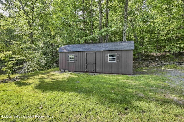 view of outdoor structure with a yard