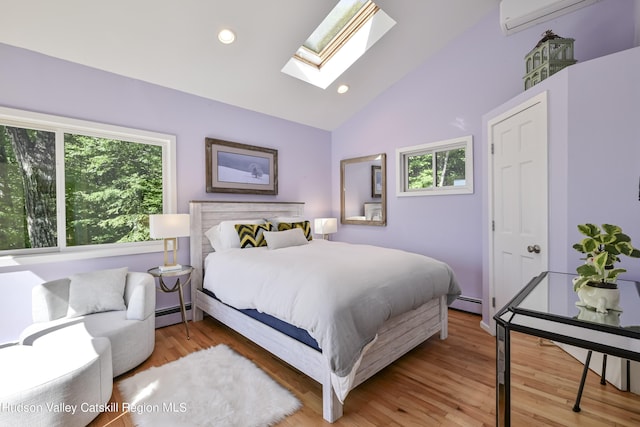 bedroom with hardwood / wood-style flooring, lofted ceiling with skylight, a wall unit AC, and a baseboard heating unit