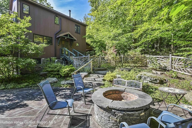 view of patio with an outdoor fire pit