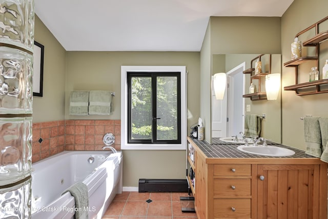 bathroom with tile patterned floors, vanity, a tub, and a baseboard radiator