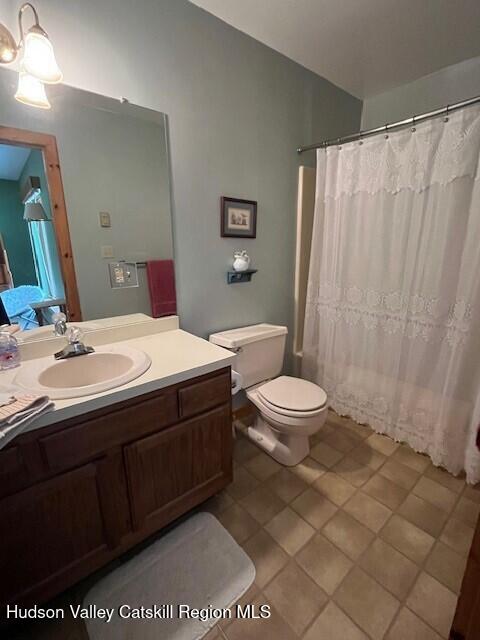 45 Windham Ridge Rd Unit 15C, Windham, NY 12496 - full bath featuring toilet, vanity, and tile patterned floors