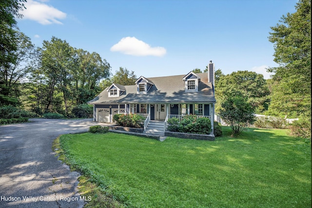 172 Shields Rd, Red Hook, NY 12571 - new england style home featuring covered porch, asphalt driveway, a chimney, a front lawn, and an attached garage