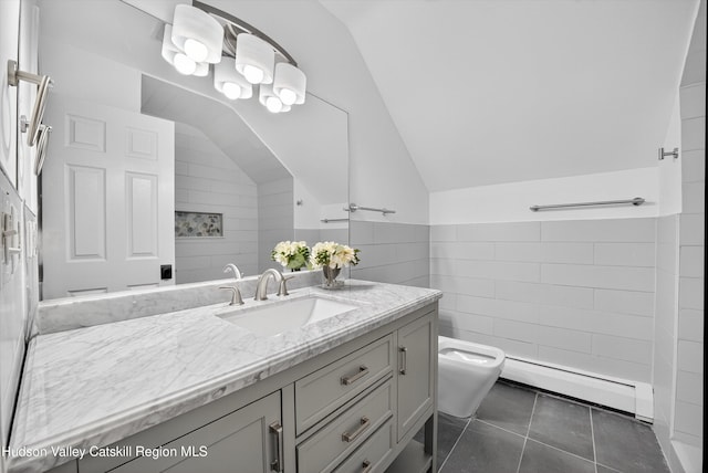 172 Shields Rd, Red Hook, NY 12571 - bathroom featuring baseboard heating, lofted ceiling, vanity, tile walls, and tile patterned flooring