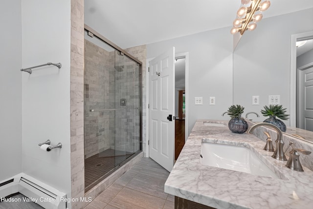 172 Shields Rd, Red Hook, NY 12571 - bathroom with double vanity, a stall shower, and a chandelier