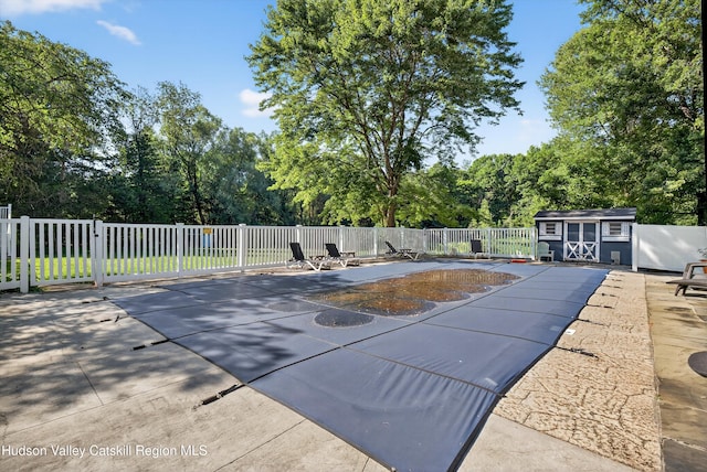 172 Shields Rd, Red Hook, NY 12571 - view of swimming pool with a shed, a patio area, and view of wooded area