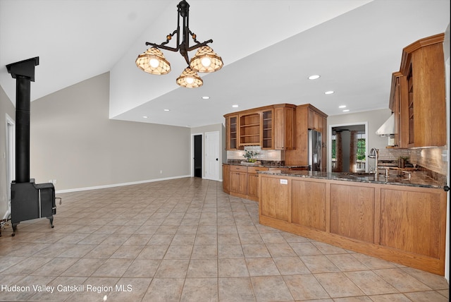 172 Shields Rd, Red Hook, NY 12571 - kitchen with stainless steel fridge, backsplash, brown cabinetry, open shelves, and recessed lighting