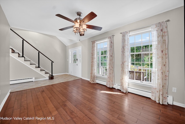 172 Shields Rd, Red Hook, NY 12571 - foyer entrance featuring a baseboard heating unit, hardwood / wood-style flooring, stairway, a ceiling fan, and lofted ceiling