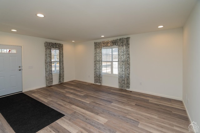 foyer featuring recessed lighting, wood finished floors, and baseboards