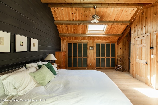 88 S Durham Estates Rd, Cairo, NY 12405 - bedroom featuring wooden walls, light wood-type flooring, a skylight, and wooden ceiling