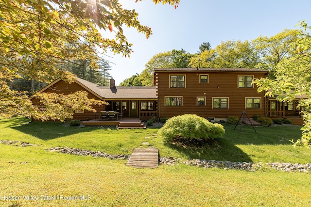 88 S Durham Estates Rd, Cairo, NY 12405 - back of property featuring a chimney, a deck, and a yard
