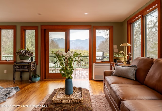 sunroom / solarium featuring a mountain view