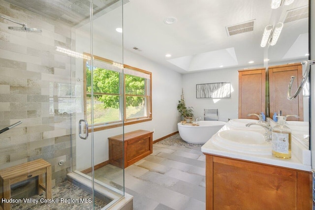 bathroom featuring vanity and shower with separate bathtub