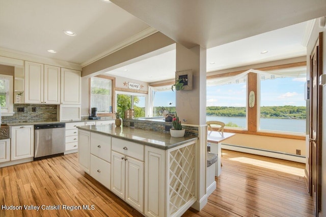 kitchen featuring stainless steel dishwasher, a baseboard radiator, a water view, light hardwood / wood-style floors, and a kitchen island