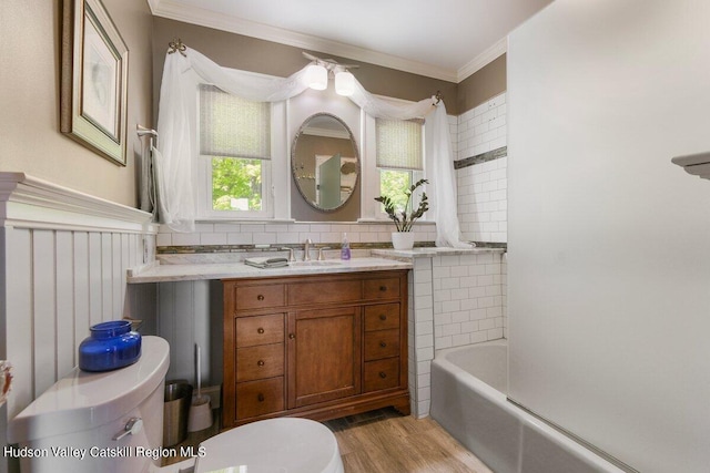 full bathroom featuring vanity, bathing tub / shower combination, crown molding, toilet, and wood-type flooring