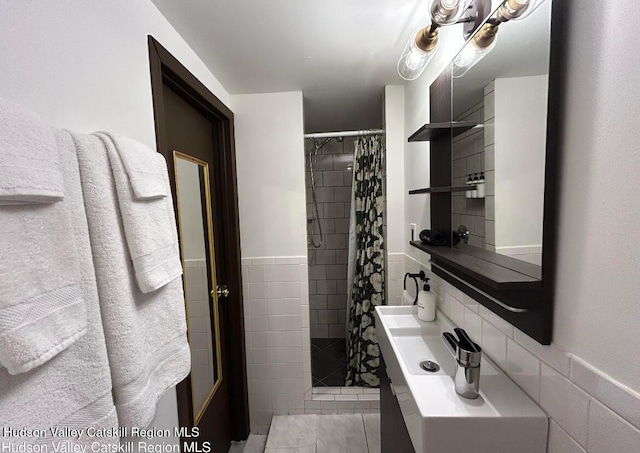 bathroom with tile patterned floors and walk in shower