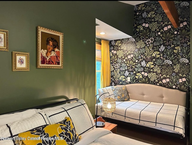 bedroom featuring beamed ceiling