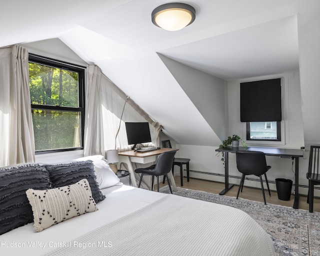 20 Sutton Hollow Rd, Windham, NY 12496 - bedroom featuring an office area, wood finished floors, lofted ceiling, and a baseboard radiator