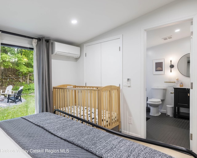20 Sutton Hollow Rd, Windham, NY 12496 - tiled bedroom featuring a wall unit AC, recessed lighting, vaulted ceiling, ensuite bathroom, and a closet