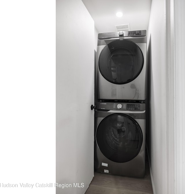 20 Sutton Hollow Rd, Windham, NY 12496 - laundry area with stacked washer and clothes dryer and wood finished floors