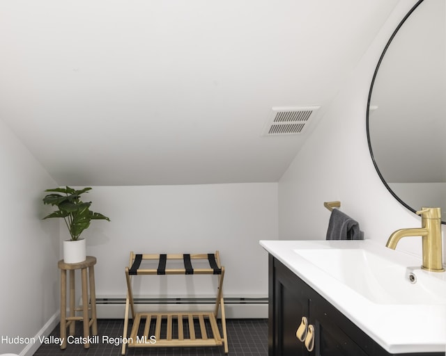 20 Sutton Hollow Rd, Windham, NY 12496 - bathroom featuring a baseboard heating unit, vanity, vaulted ceiling, and baseboards