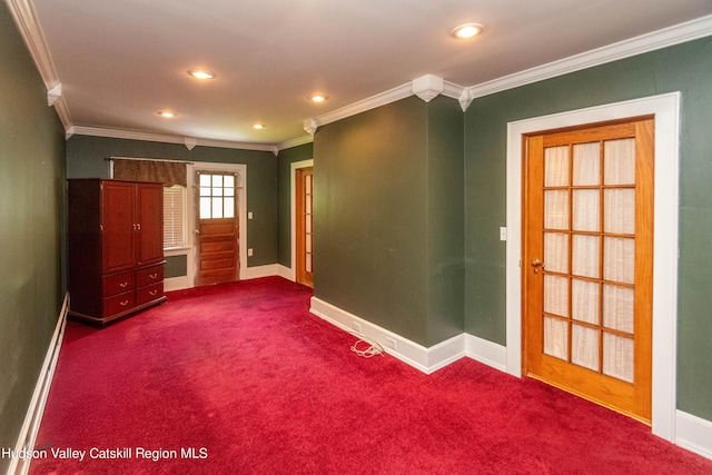 unfurnished room with carpet flooring, ornamental molding, and baseboard heating