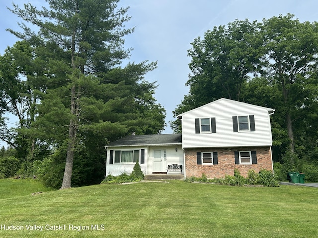 48 Kensington Dr, Hopewell Junction, NY 12533 - tri-level home with a front yard and brick siding