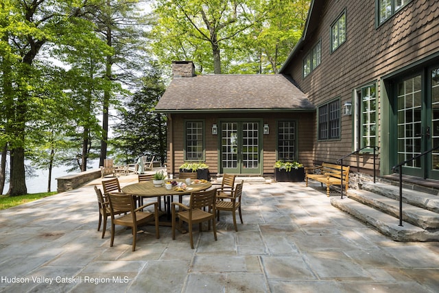 196 Wellington Ln, Cooperstown, NY 13326 - view of patio featuring french doors, entry steps, and outdoor dining space