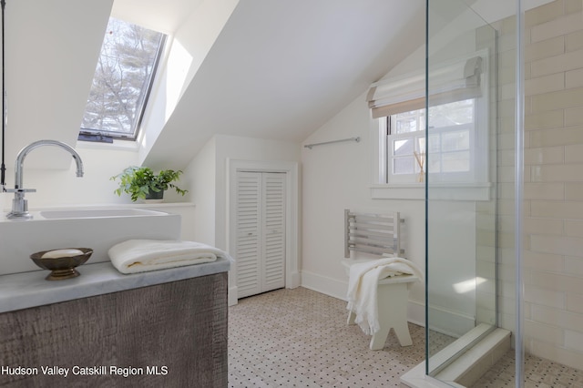 196 Wellington Ln, Cooperstown, NY 13326 - full bath with a stall shower, vaulted ceiling, and tile patterned floors