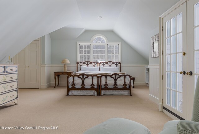196 Wellington Ln, Cooperstown, NY 13326 - bedroom featuring carpet, lofted ceiling, and a wainscoted wall