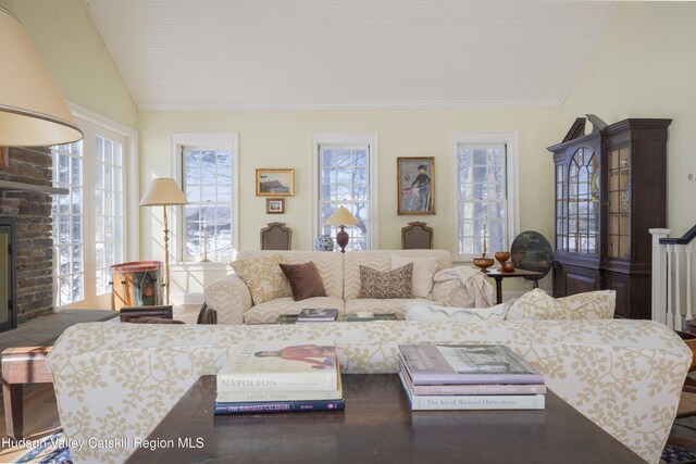 196 Wellington Ln, Cooperstown, NY 13326 - living area with lofted ceiling, crown molding, and a fireplace