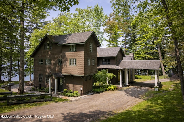 196 Wellington Ln, Cooperstown, NY 13326 - view of front facade with driveway, roof with shingles, and a chimney