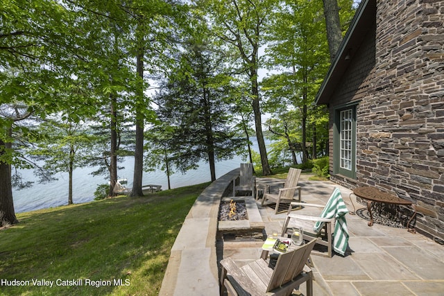 196 Wellington Ln, Cooperstown, NY 13326 - view of patio with a water view and a fire pit