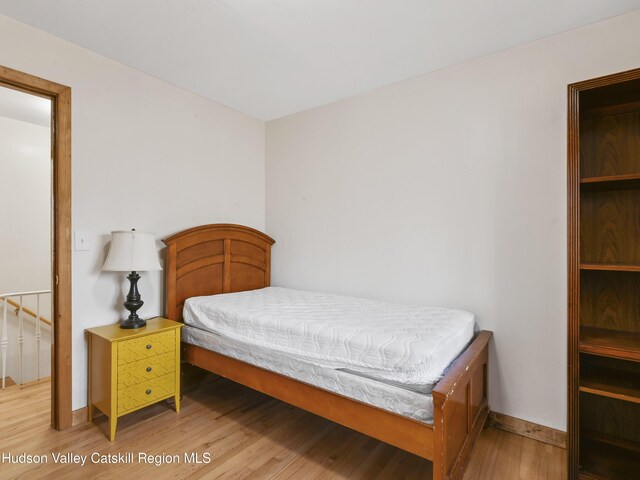 bedroom with hardwood / wood-style floors