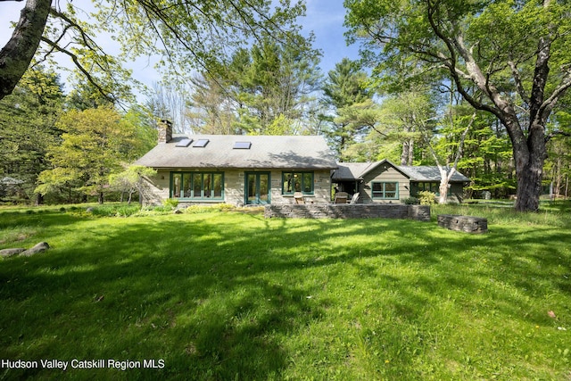 11 Louie Way, Woodstock, NY 12498 - rear view of property with a chimney, stone siding, and a lawn