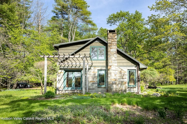 11 Louie Way, Woodstock, NY 12498 - back of property featuring a chimney, stone siding, a pergola, and french doors