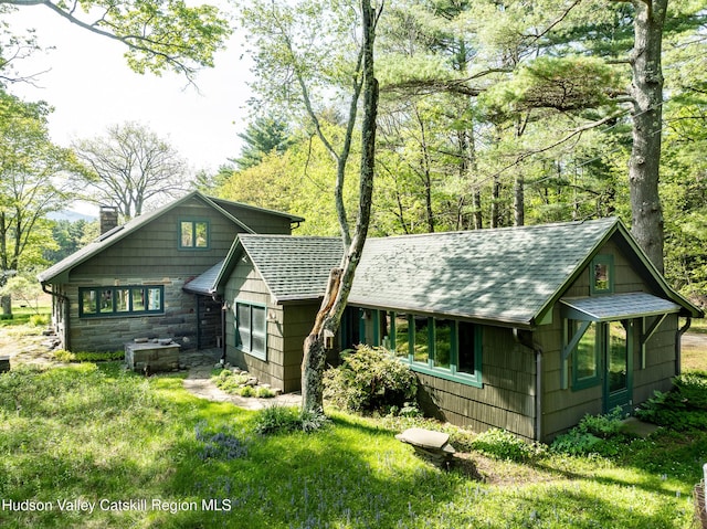 11 Louie Way, Woodstock, NY 12498 - rustic home featuring a chimney and roof with shingles