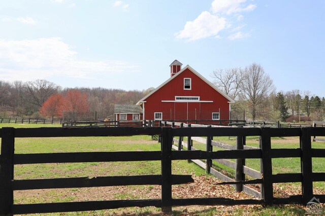 524 County Route 17, North Chatham, NY 12132 - gate featuring an outbuilding and a view of countryside