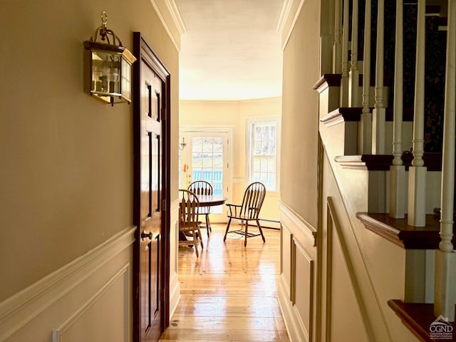 524 County Route 17, North Chatham, NY 12132 - hall featuring ornamental molding, light wood finished floors, and a decorative wall